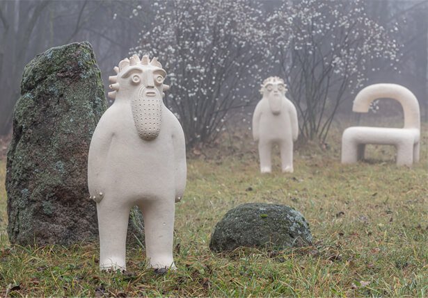 Ceramic figures by Makhno Studio in a misty garden