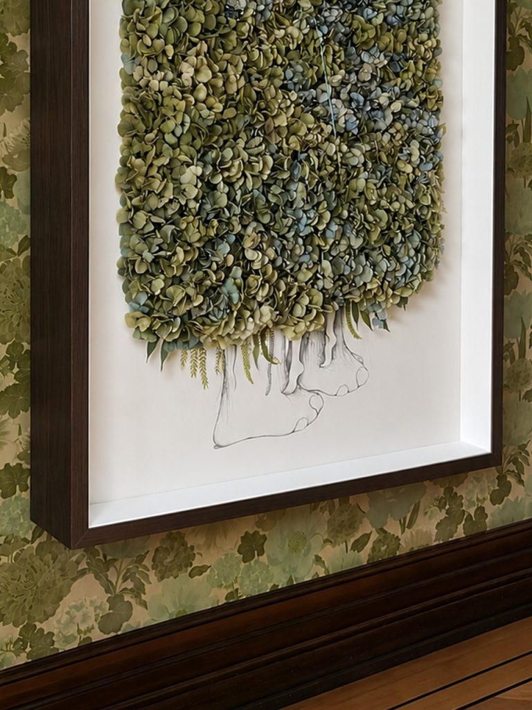 Framed wall piece of green dried flowers