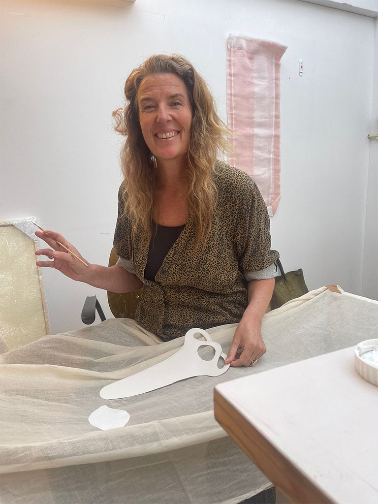 Artist working on a ceramic piece in the studio